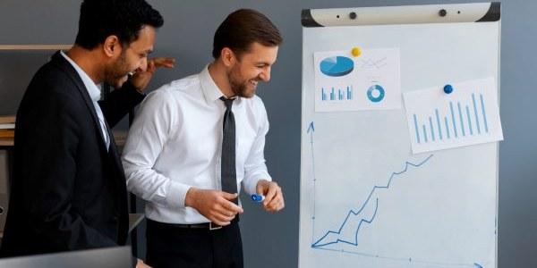 Business person looking at finance graphs