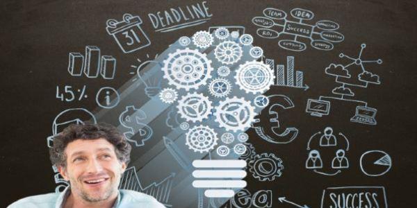 Businessman with a bulb made of gears