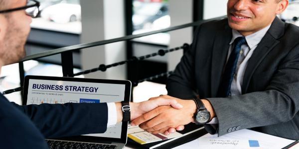 Businessmen handshake deal agreement concept