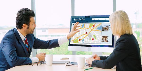 Two Persons looking at the computer screen