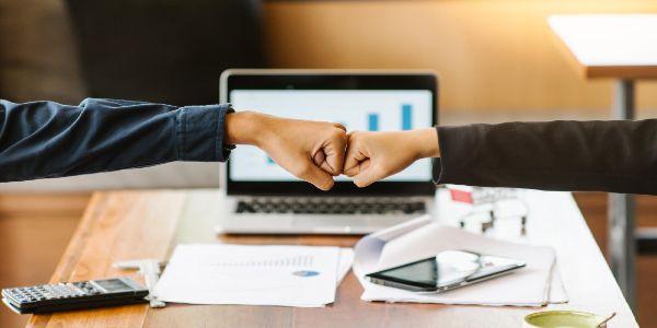 High angle view of businessmen bumping fist