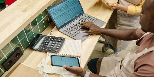 working with finance in team using laptop