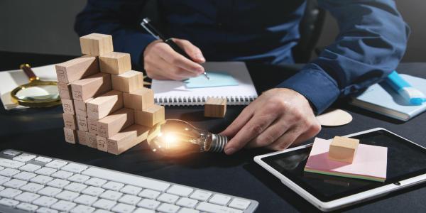 Man holding light bulb at office