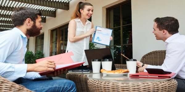 Excited businesswoman showing report
