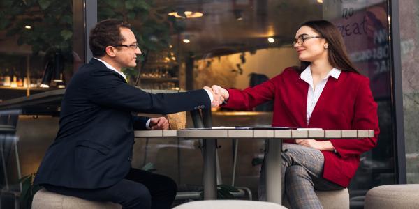 Business people having a business negotiation at a cafe