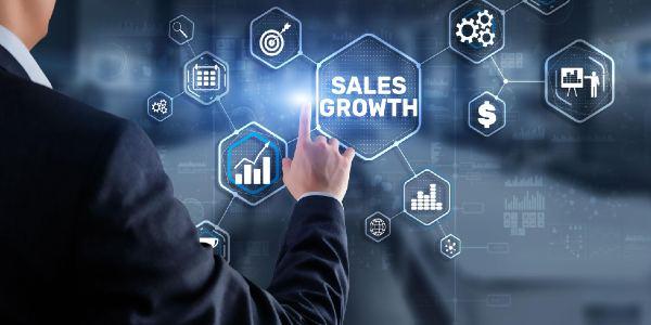 Sales growth man clicks inscription on virtual 3d screen