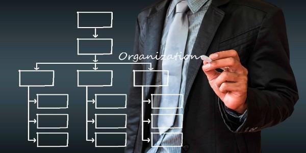 Digital composite image of businessman drawing chart