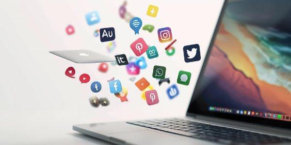 Google facebook instragrm icons popping out the laptop