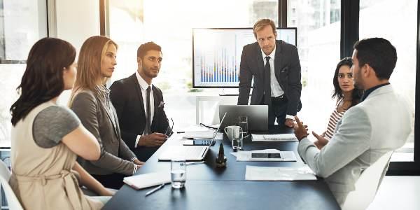 Businessman team and meeting with analytics on screen for user personas customer insights and feedback or income level