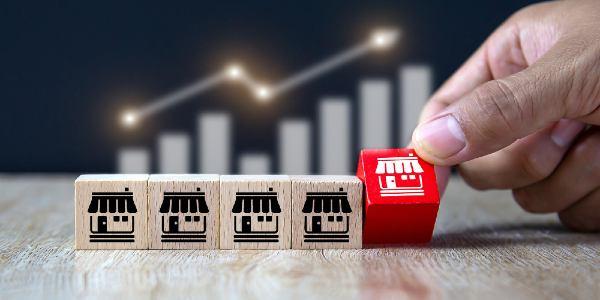 Hand choose wooden block stack with franchises business store icon