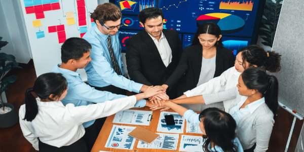 Multiracial business people make synergy hand stack together habiliment