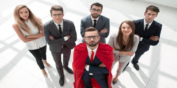 Top view businessman superman and his business team standing together business concept