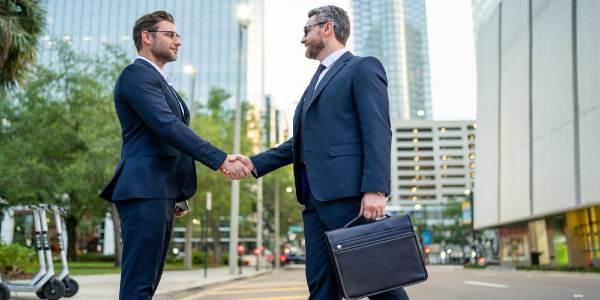 Business man shaking hands two businessmen handshake outdoor