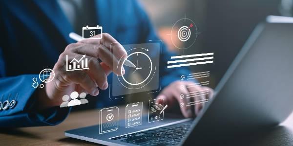 Business professional working on a laptop with clock and to do list interface time management and productivity tools