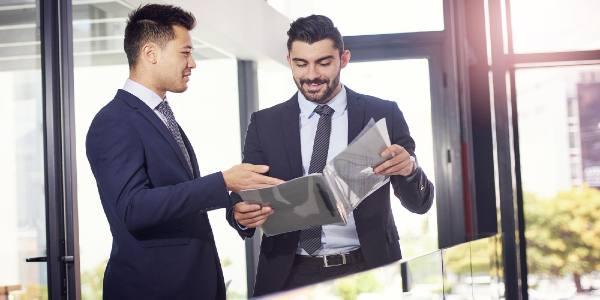 Business people teamwork and discussion of document or legal case for advice in office