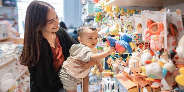 Mother take her year old son to buy toys