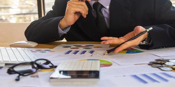 Midsection of man working on table