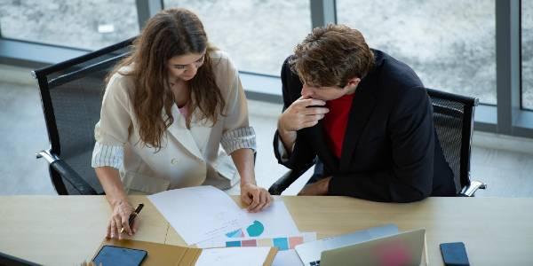 People working on papers on table
