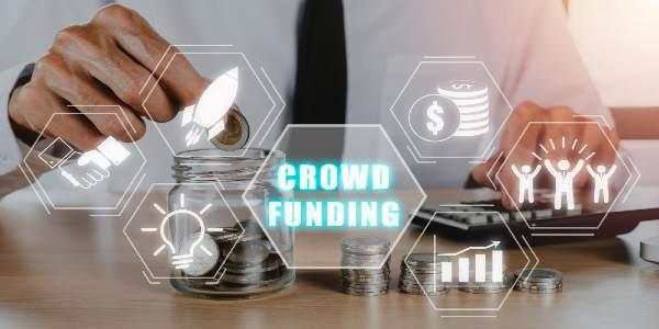 Crowdfunding concept business person hand putting money into jar glass with crowdfunding icon