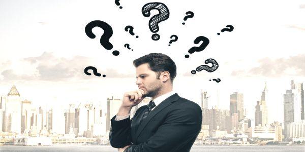 Businessman with drawing question mark