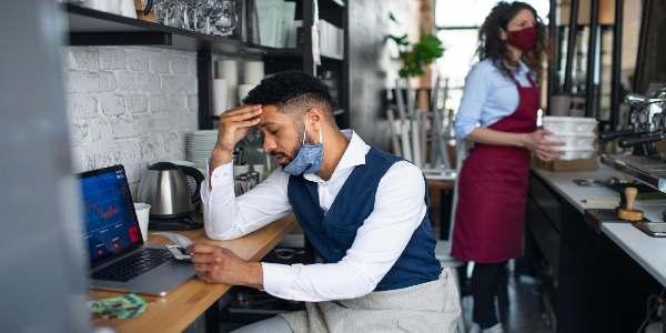 Frustrated coffee shop manager in cafe small business concept