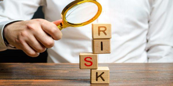 Man explores a tower of cubes with the word risk search