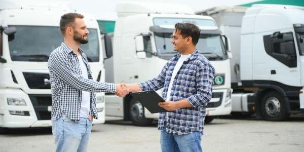 The truck driver receives documents for the cargo and the delivery route