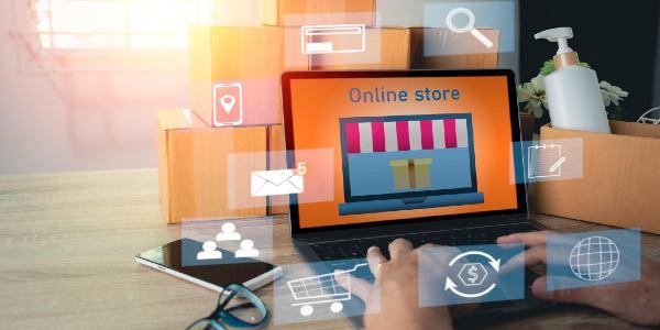 Online business store on laptop screen and digital icons online business concept