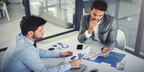 Collaboration charts and men with tablet office and discussion for business